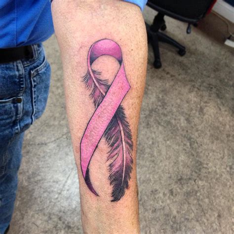 The quote reads she lived and laughed and loved and left. . Breast cancer ribbon tattoo